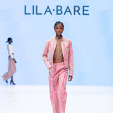 Handmade luxury leather and bead halter by LilaBare on runway with pink separates