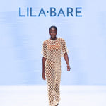 Model wearing handmade crochet dera dress by African designer brand LilaBare — featuring hand-beaded sequins and artisan craftsmanship