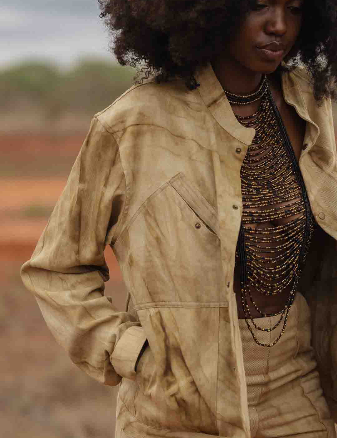 Close-up of chest pockets and antique brass snap button details