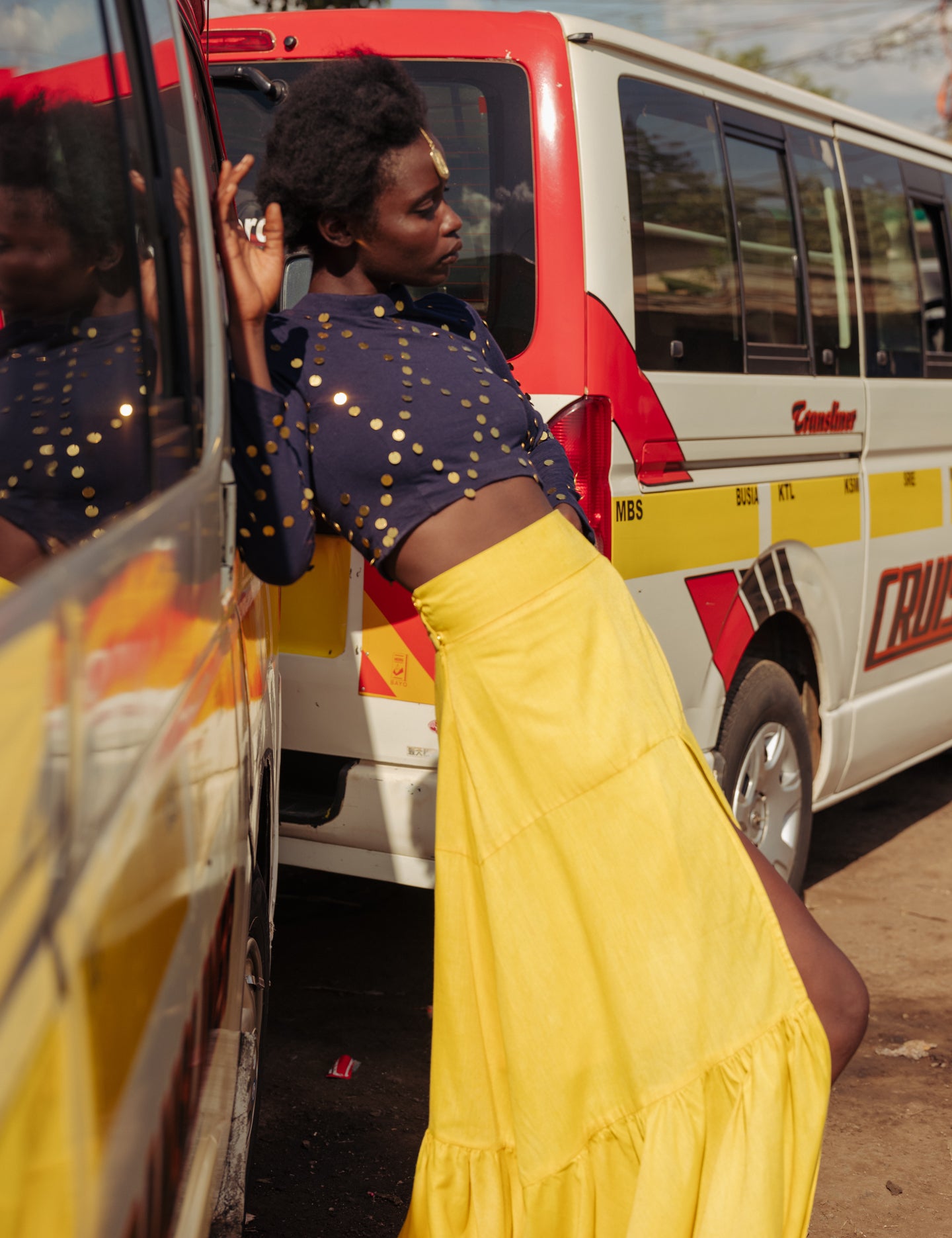 Editorial photo of skirt flowing in motion, styled with navy top