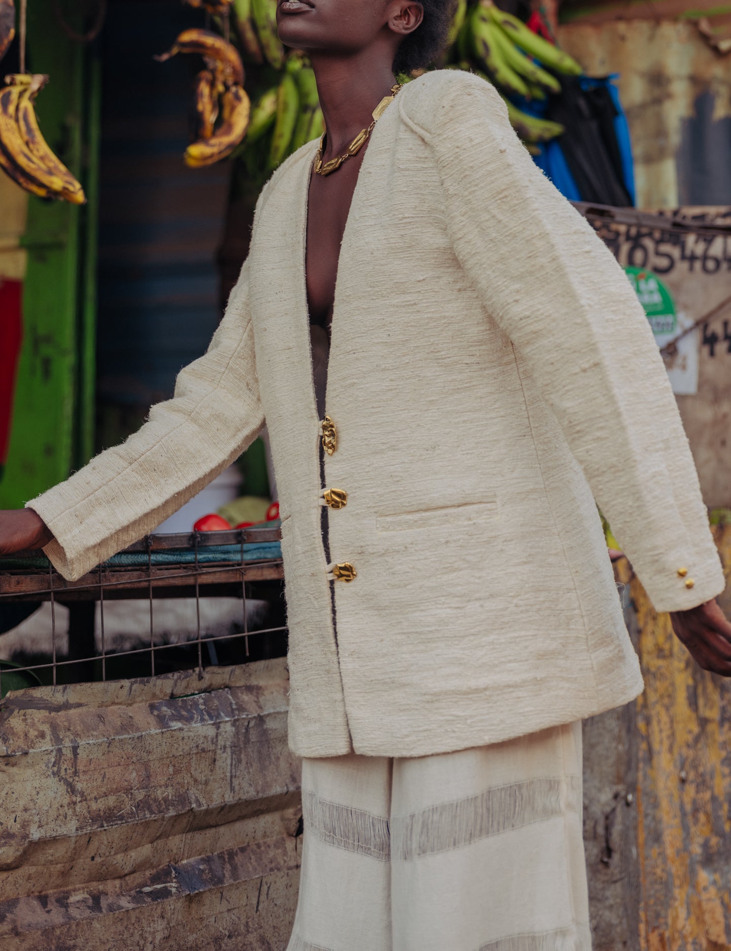 Side profile of the eco-conscious pineapple fiber blazer showing relaxed tailoring and fabric texture