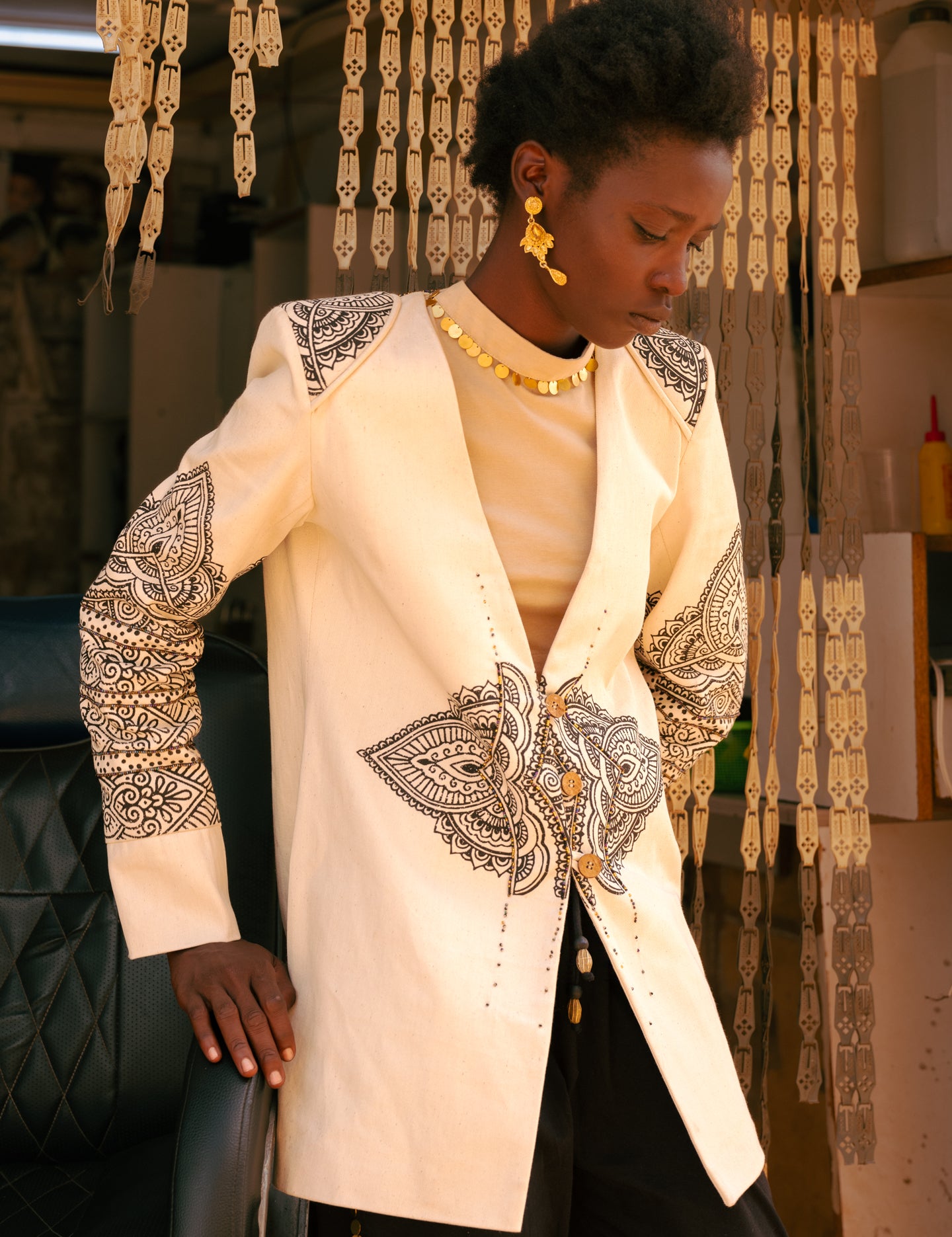 Side profile of model wearing beige long sleeve cotton crop top by LilaBare