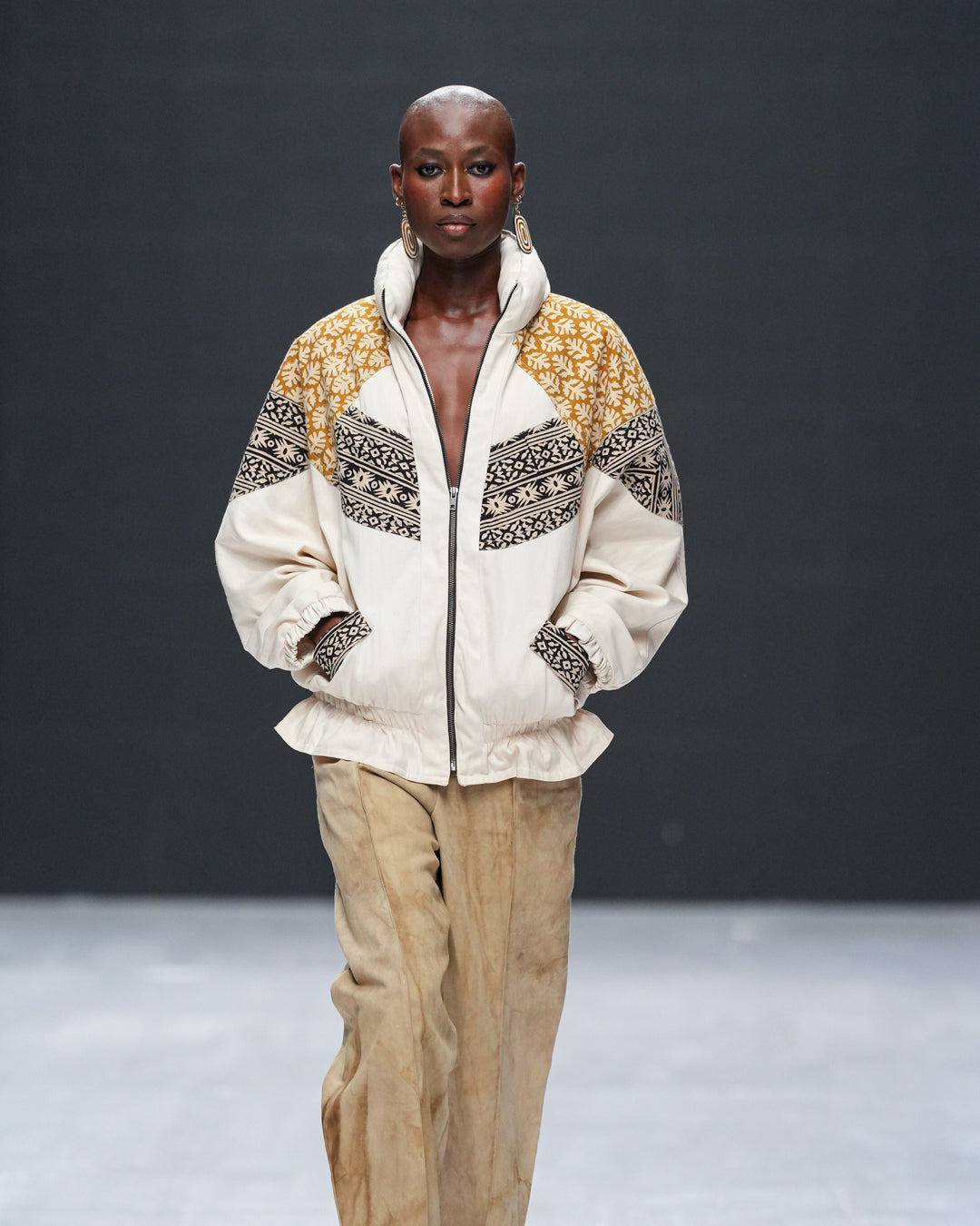 Model in hand-blockprinted oversized jacket in indigo hues, ethically made in Kenya by LilaBare on runway at Lagos Fashion Week