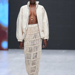 Gender-neutral fashion jacket in Kenyan woven cotton worn by runway model