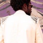 Back view close up of model in structured blazer with gold beadwork by LilaBare