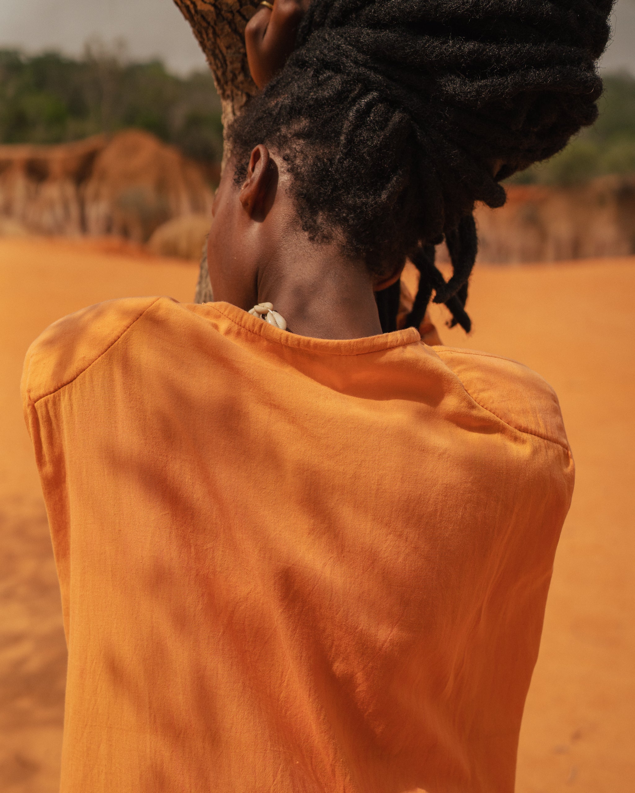 Back view of flowing Storm Kimono against natural landscape