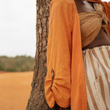 Close-up of Storm Kimono sleeve with brass button detail