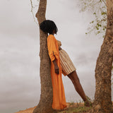 Side view of flowing Storm Kimono against natural landscape