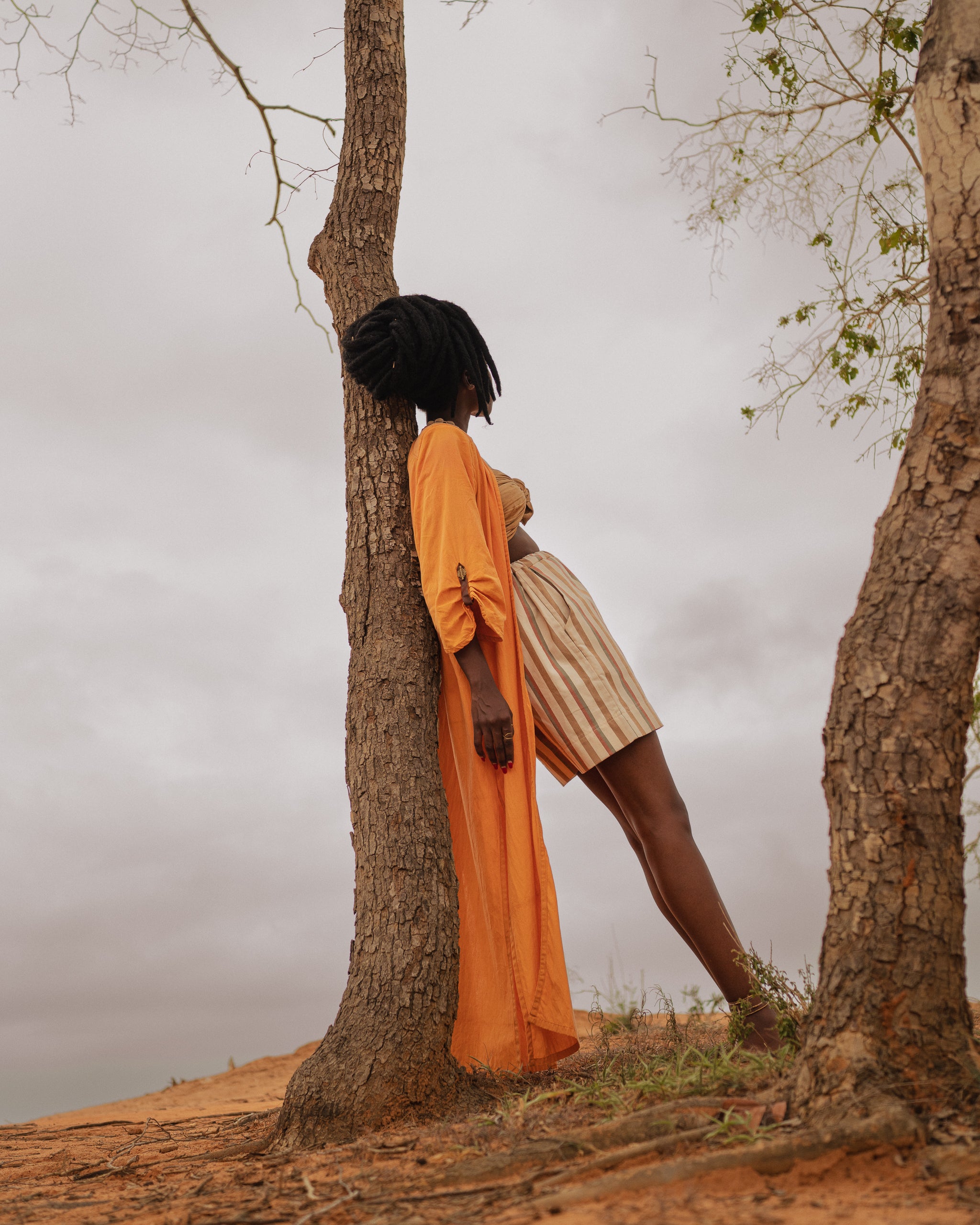 Side view of flowing Storm Kimono against natural landscape